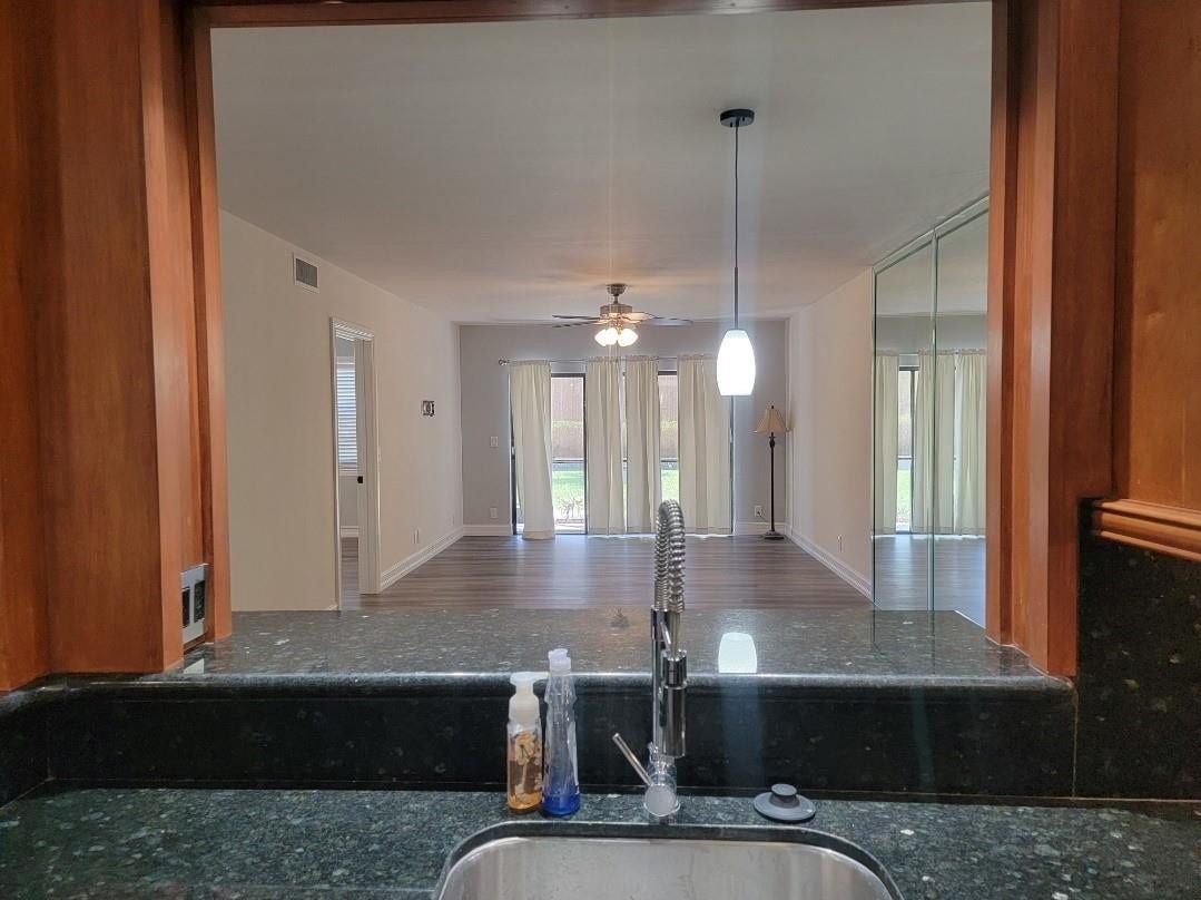 1001 SE 6TH Avenue, #127, Deerfield Beach, Deerfield Beach, FL 33441 Wood-finish cabinetry framing a pass-through opening