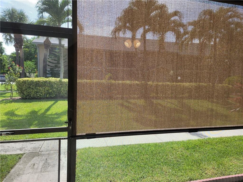 1001 SE 6TH Avenue, #127, Deerfield Beach, Deerfield Beach, FL 33441 Screened enclosure with textured roller shade