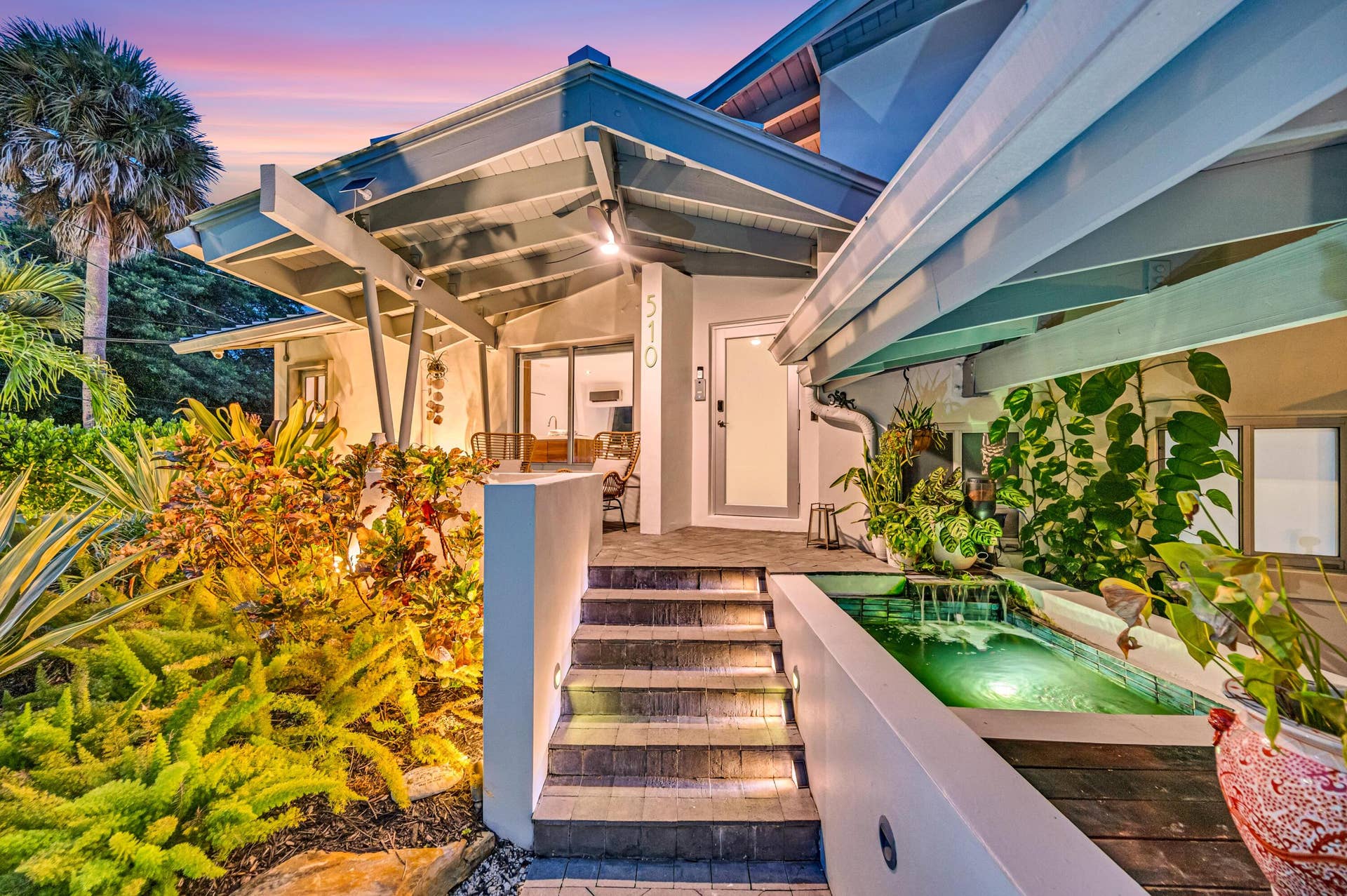 510 SW 18th Avenue, Fort Lauderdale, FL 33312 Architectural entry with an open-beam portico and a white stucco facade