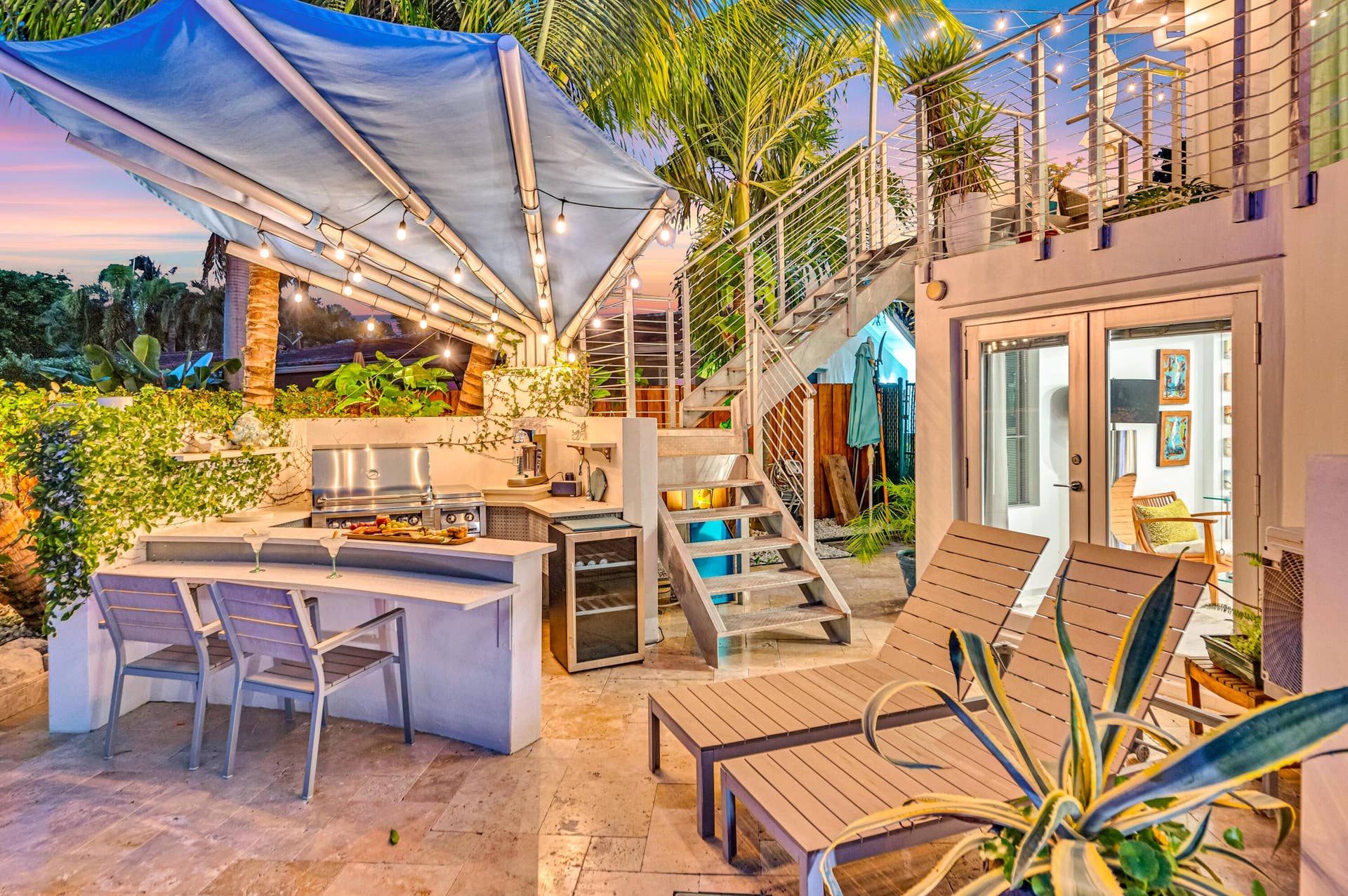 510 SW 18th Avenue, Fort Lauderdale, FL 33312 Outdoor kitchen with stainless steel grill, under-counter beverage cooler, and built-in bar seating