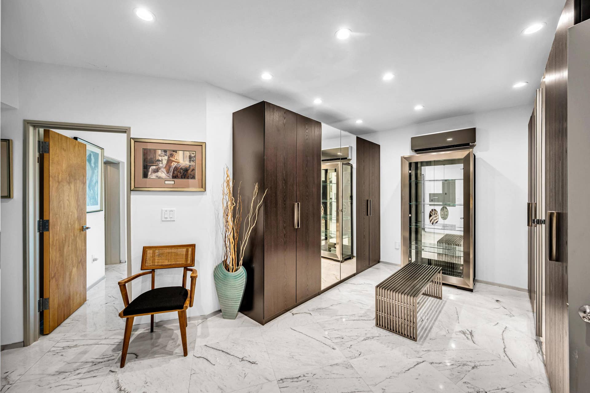 510 SW 18th Avenue, Fort Lauderdale, FL 33312 Recessed lighting, white walls, wood-finish flooring, built-in dark wood cabinetry, and a display cabinet with glass doors