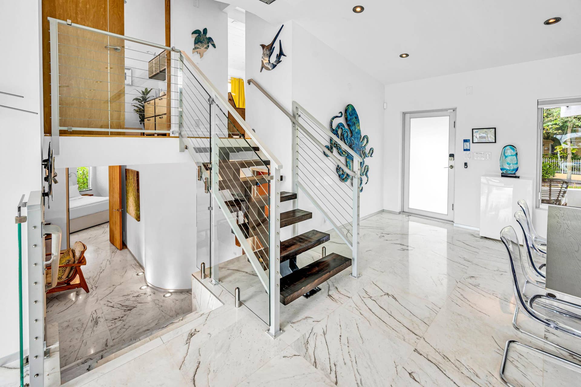 510 SW 18th Avenue, Fort Lauderdale, FL 33312 Modern staircase featuring wood treads, glass panels, and stainless steel railings