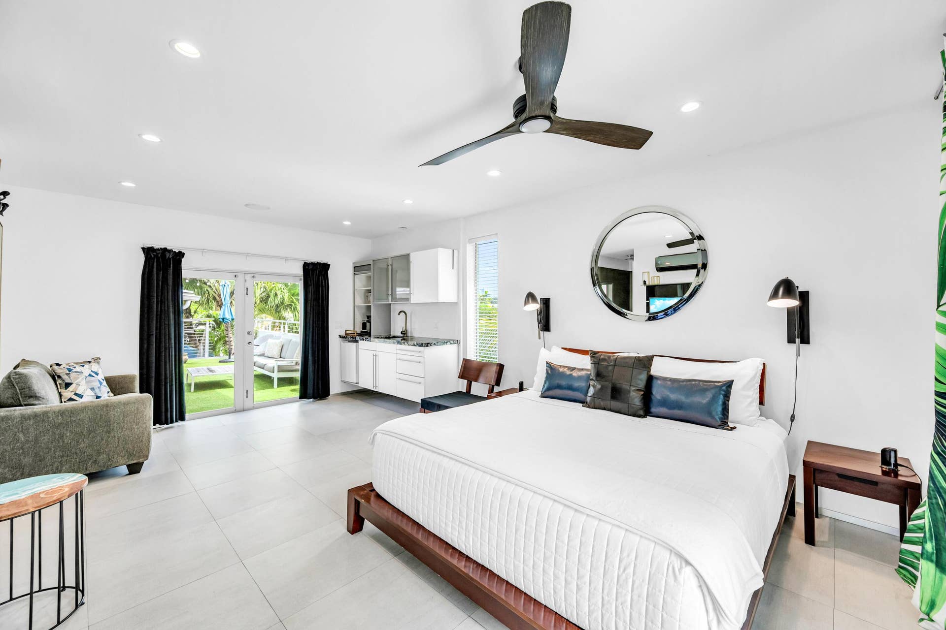 510 SW 18th Avenue, Fort Lauderdale, FL 33312 Recessed lighting, ceiling fan, white cabinetry with integrated sink, glass French doors, and a manicured lawn