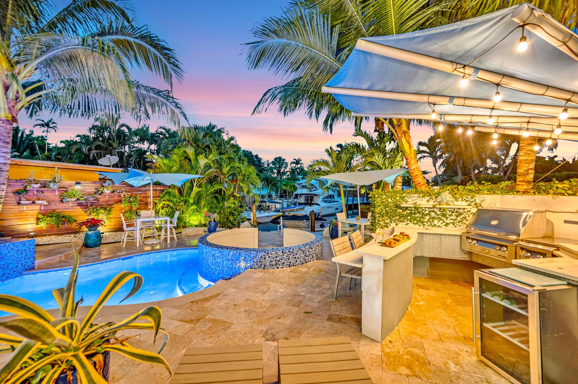 510 SW 18th Avenue, Fort Lauderdale, FL 33312 Resort-style outdoor living area with a built-in grill station, outdoor bar, and integrated pool