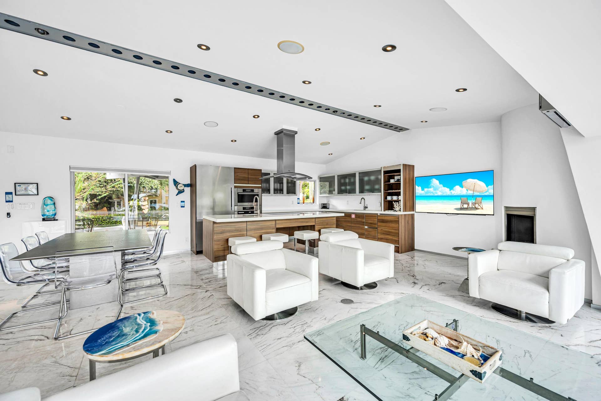510 SW 18th Avenue, Fort Lauderdale, FL 33312 Modern kitchen with wood-finish cabinetry, stainless steel appliances, and a central island