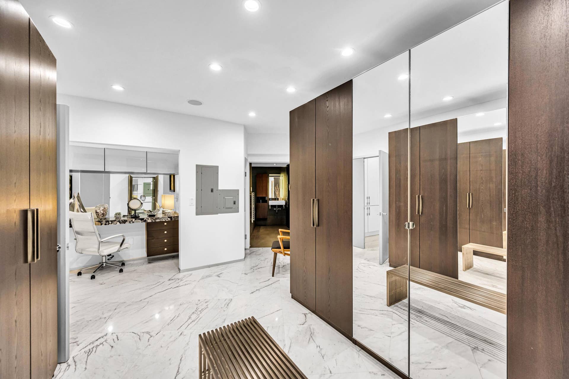 510 SW 18th Avenue, Fort Lauderdale, FL 33312 White marble-look tile flooring, recessed lighting, wood-finish cabinetry, full-height mirrored wardrobe doors, and modern wall-mounted light fixtures