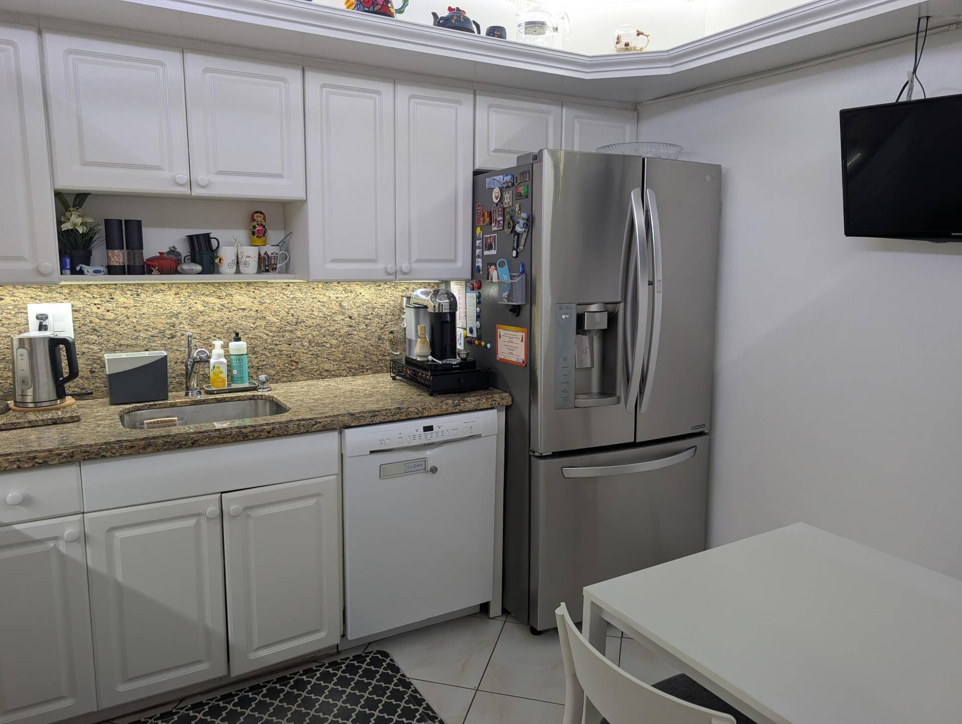 Kitchen Featuring Granite Top & Stainless Steel Appliances