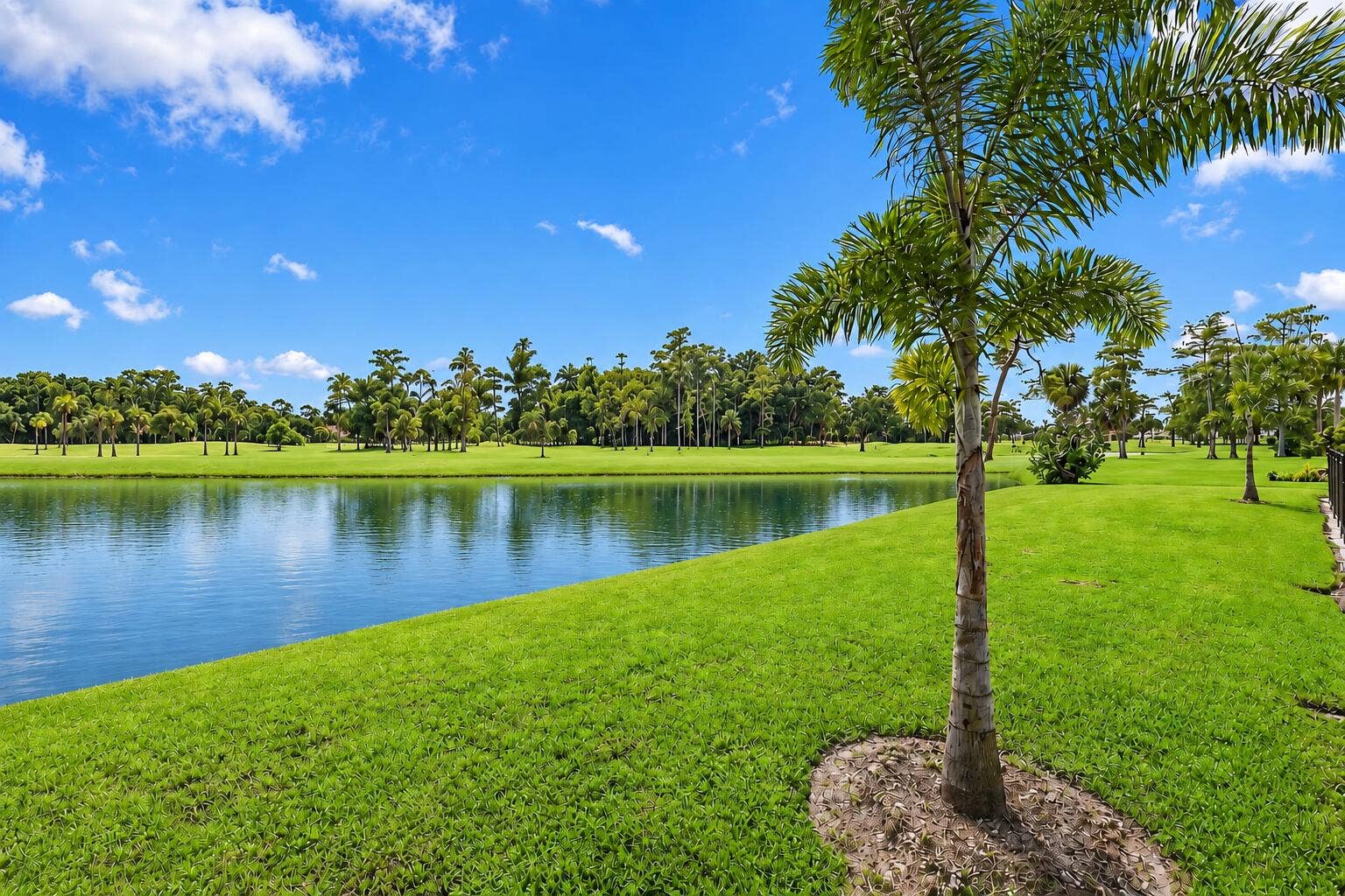 10941 BOCA WOODS Lane, Boca Raton, FL 33428 180 degree private and unobstructed lake and golf course views.