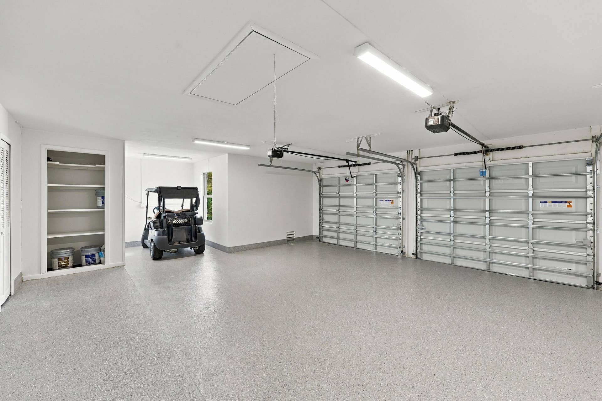 10941 BOCA WOODS Lane, Boca Raton, FL 33428 oversized garage can house golf cart.