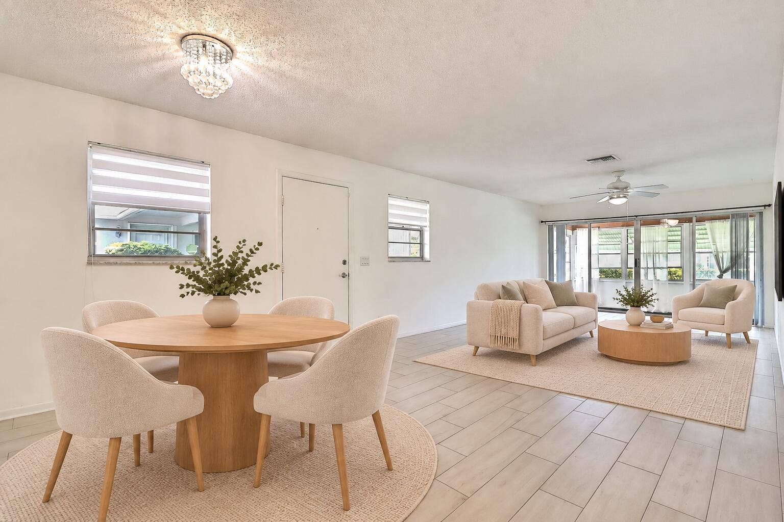 450 BLUEBIRD Lane, Delray Beach, FL 33445 Spacious living area featuring tile flooring, a built-in ceiling fan, and sliding glass doors