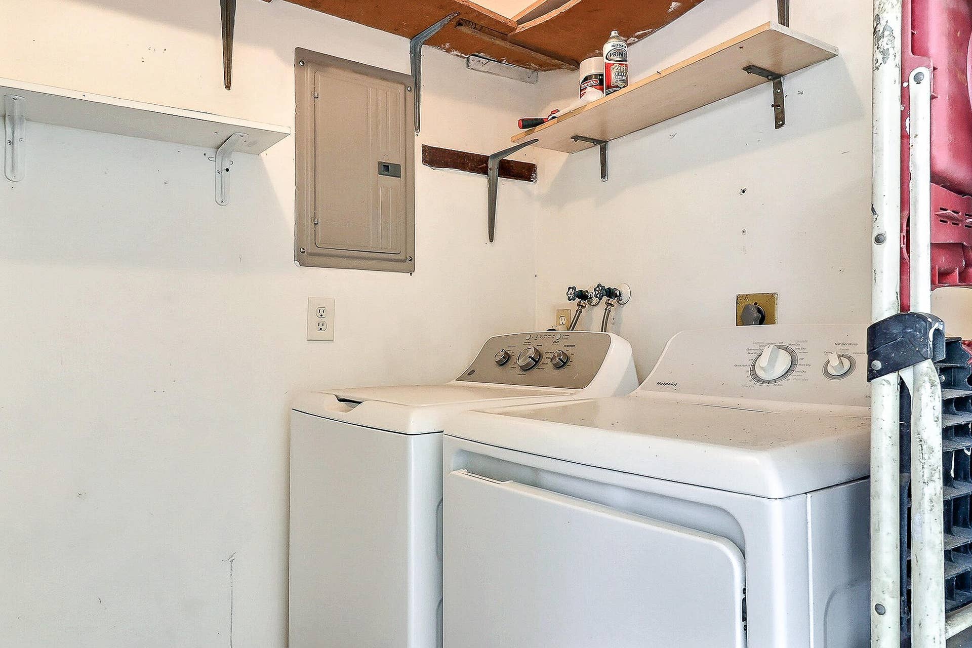 450 BLUEBIRD Lane, Delray Beach, FL 33445 White walls featuring exposed ceiling joists and mounted shelving