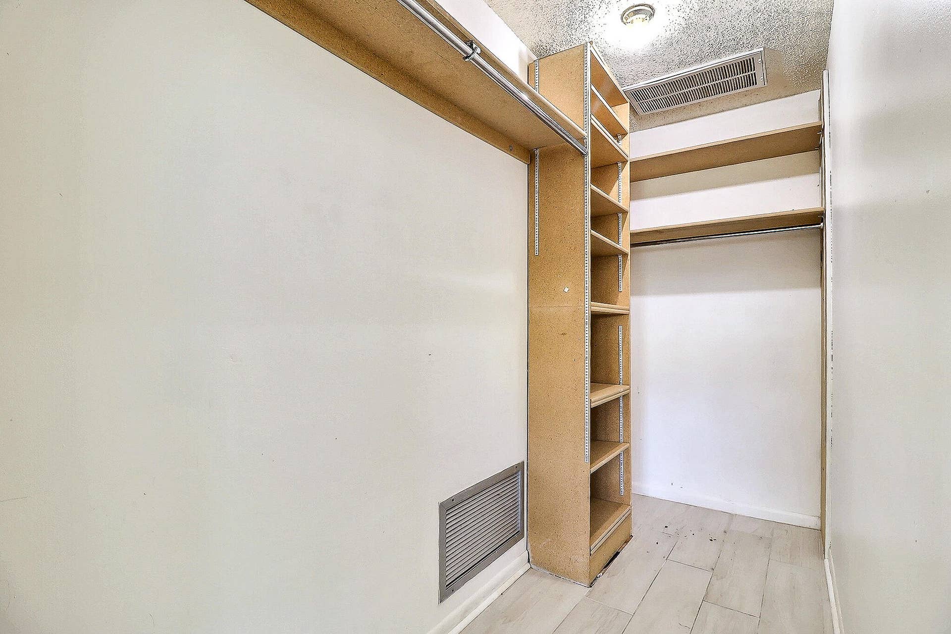 450 BLUEBIRD Lane, Delray Beach, FL 33445 Built-in shelving, hanging rods, wood-finish flooring, recessed lighting