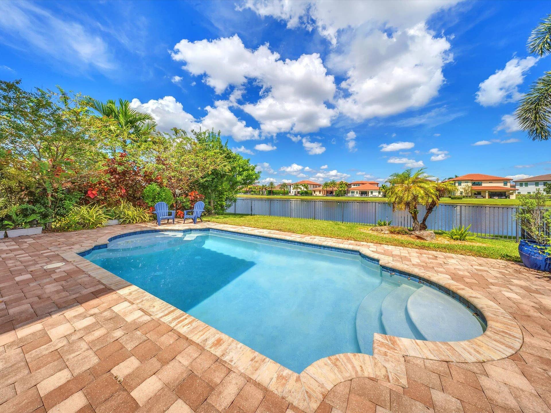 11965 S BAYPOINT Circle, Parkland, FL 33076 pristine pool and lake background