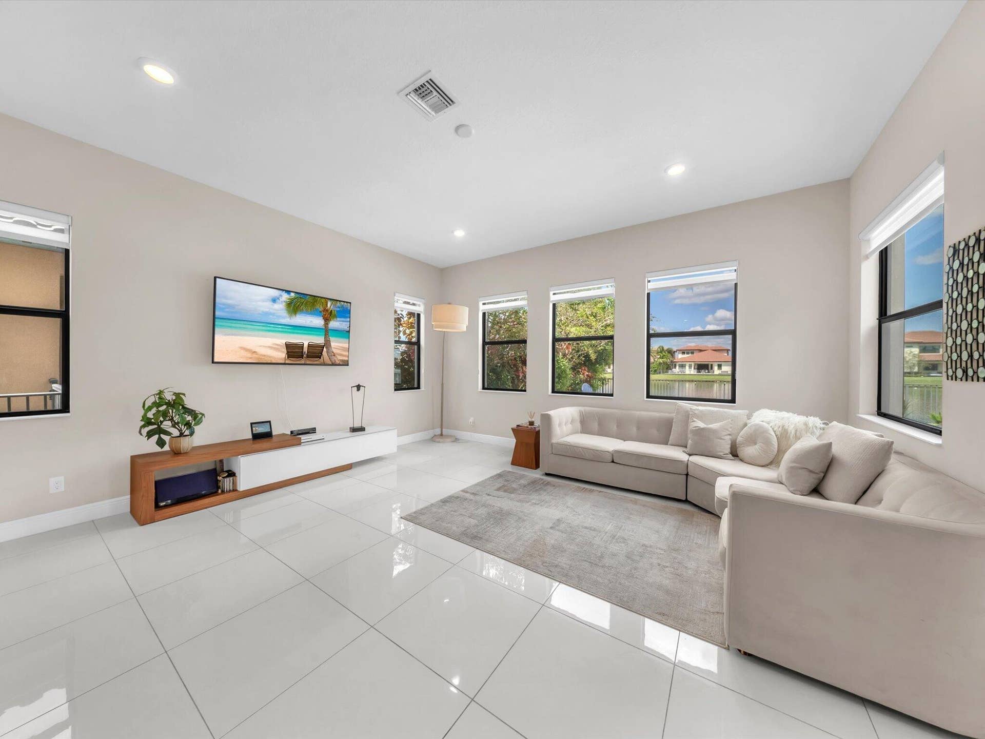 11965 S BAYPOINT Circle, Parkland, FL 33076 family room with view to lake
