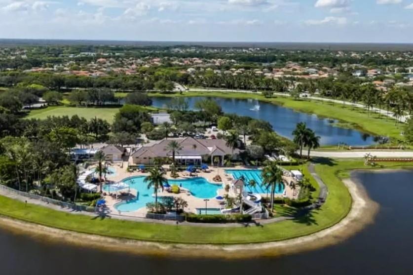 1020 Lavender Circle, Weston, FL 33327 Expansive community pool with integrated water slide and surrounding lounge areas