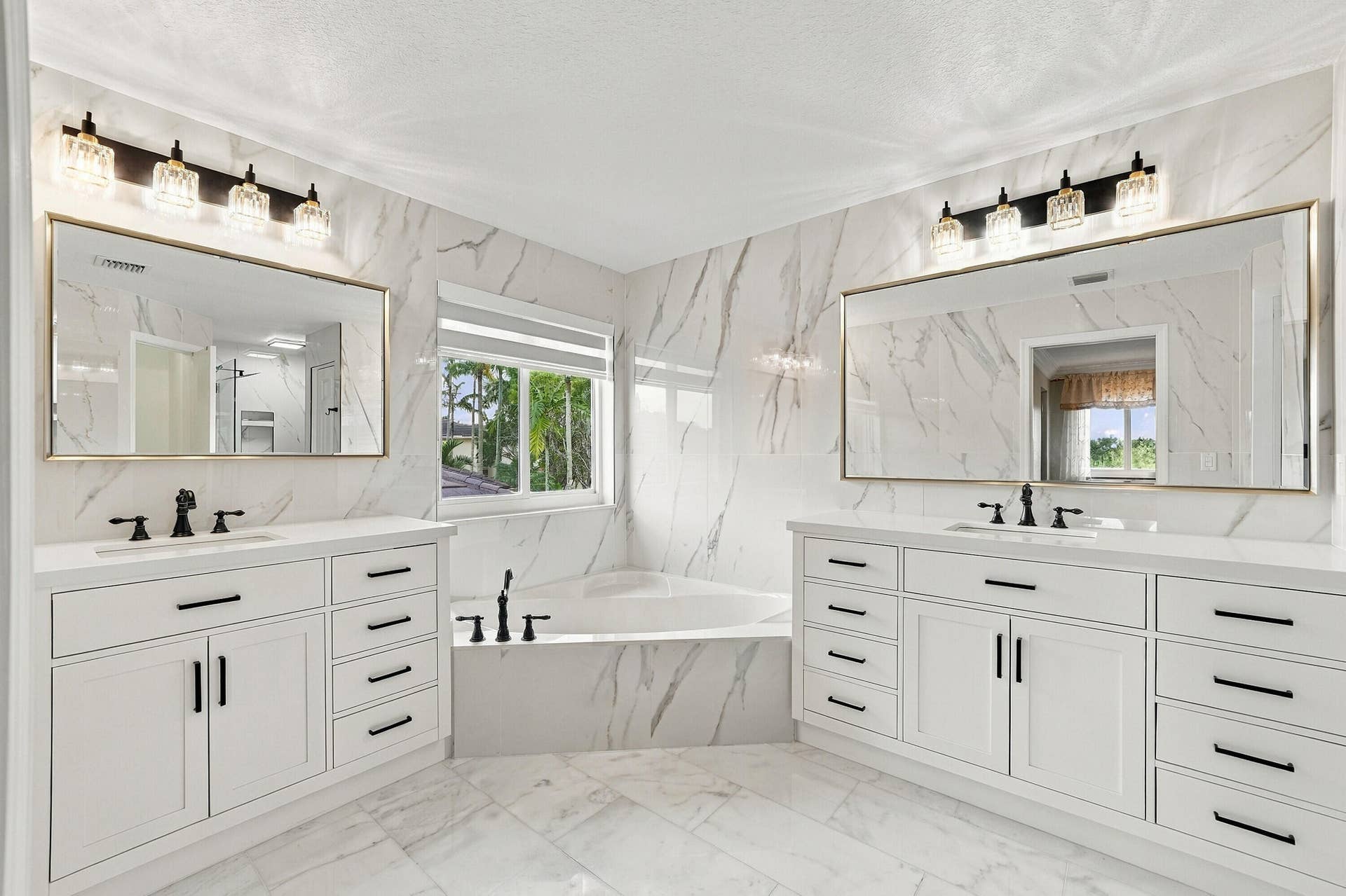 1020 Lavender Circle, Weston, FL 33327 Dual vanities with white cabinetry and quartz countertops