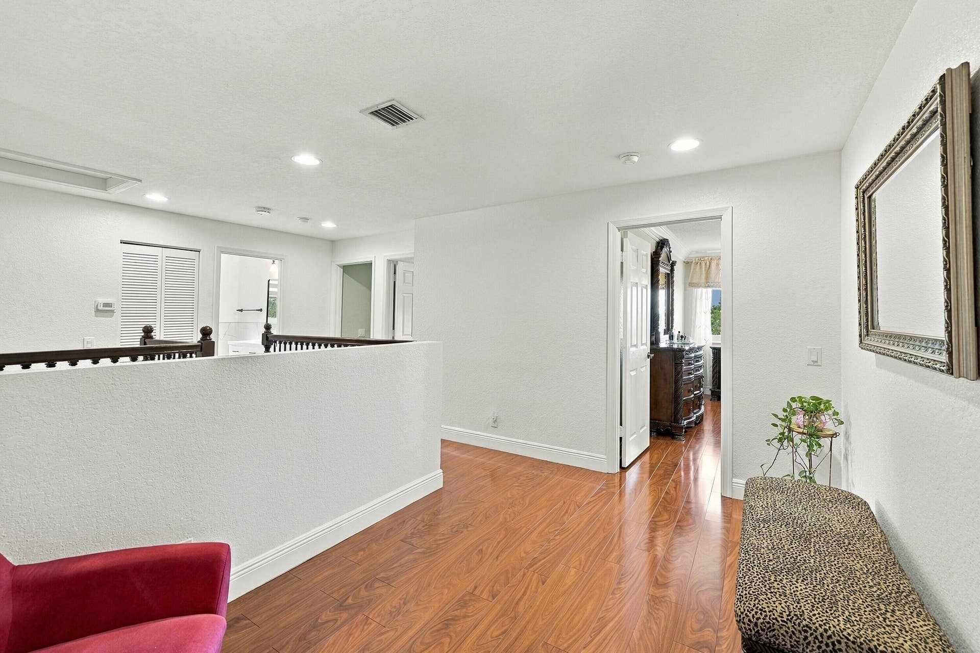 1020 Lavender Circle, Weston, FL 33327 Wood-finish flooring throughout, white painted walls, recessed lighting, and a white interior door