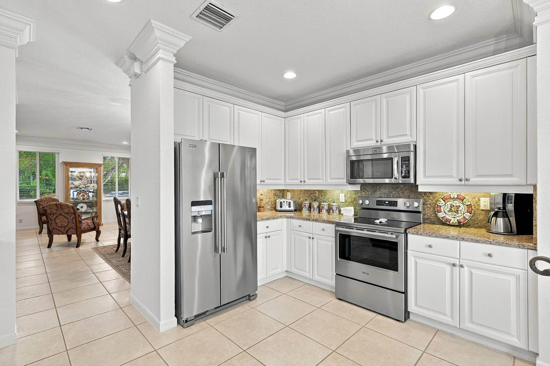 1020 Lavender Circle, Weston, FL 33327 Kitchen featuring white cabinetry, stainless steel appliances, recessed lighting, and tile flooring