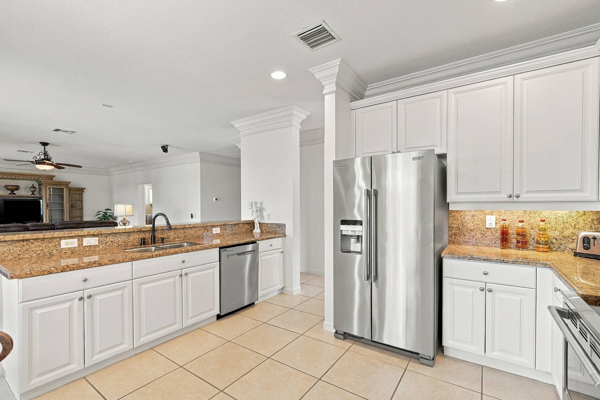 1020 Lavender Circle, Weston, FL 33327 Kitchen featuring white cabinetry, granite countertops, stainless steel appliances, and tile flooring