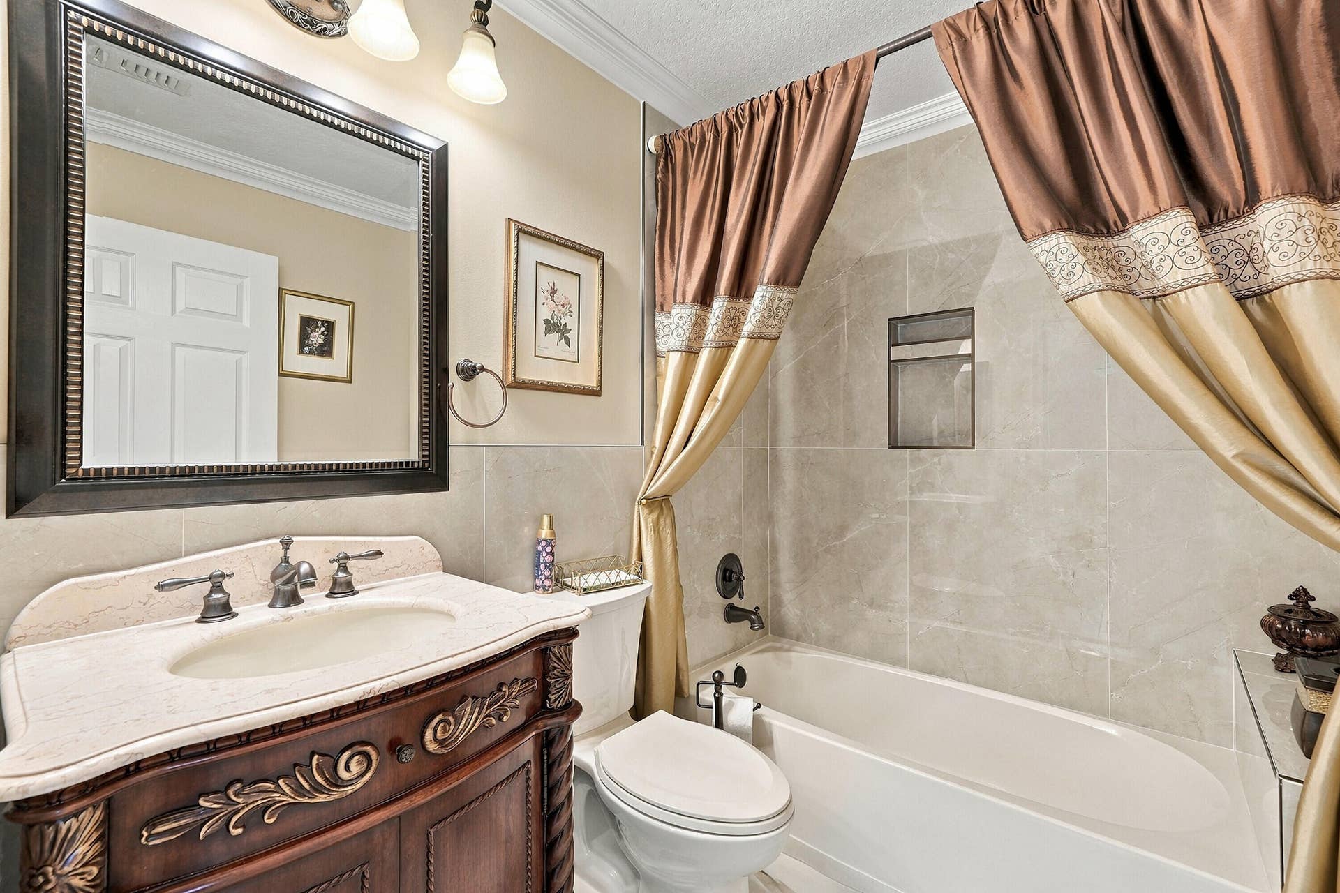 1020 Lavender Circle, Weston, FL 33327 Vanity with an ornate wood-finish base, undermount sink, and light-toned countertop