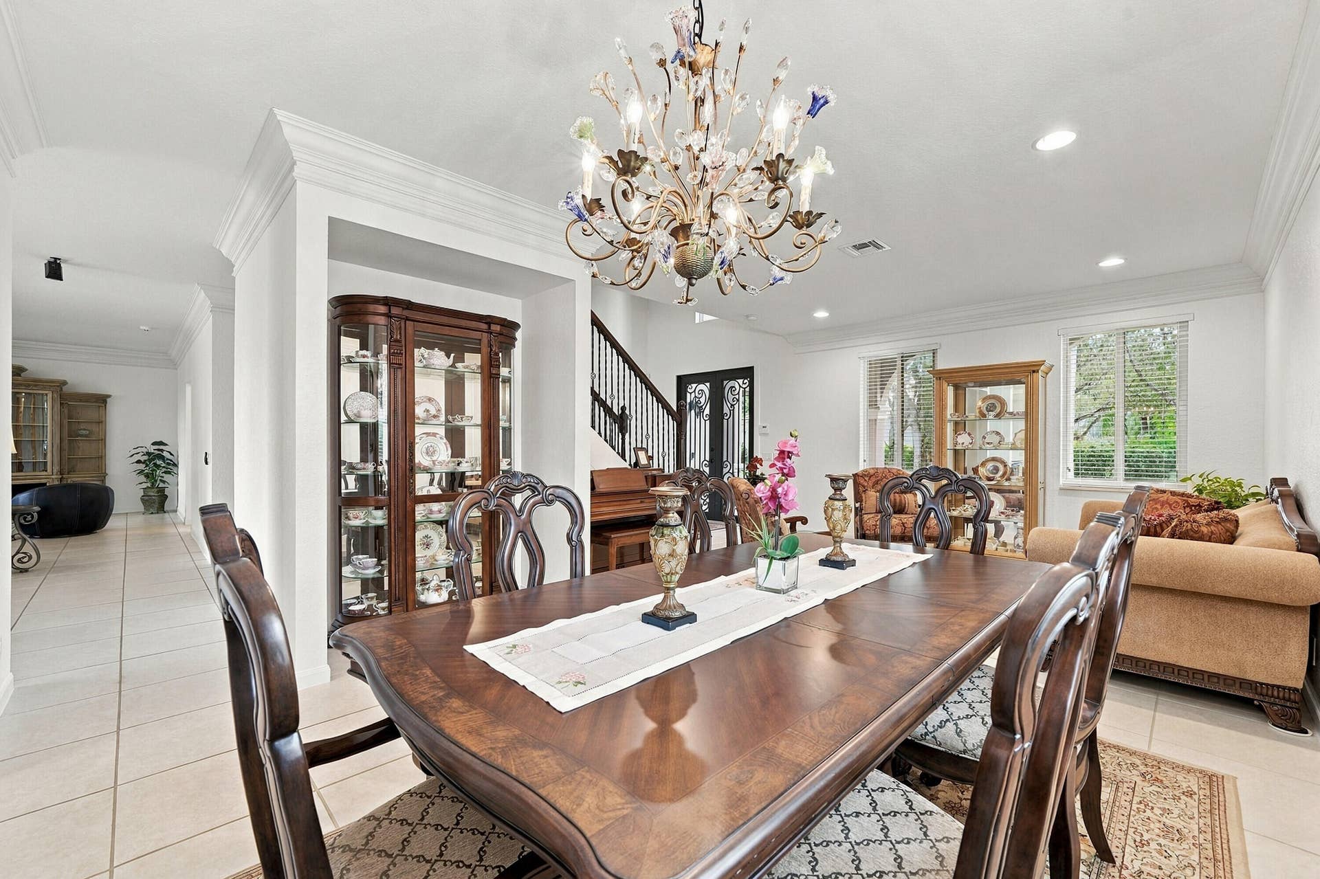 1020 Lavender Circle, Weston, FL 33327 Recessed lighting, crown molding, double pane windows, tile flooring, and an ornate chandelier