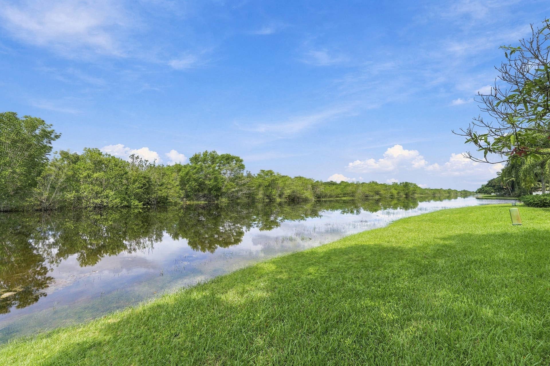 1020 Lavender Circle, Weston, FL 33327 Expansive waterway with a natural shoreline and lush, green lawn