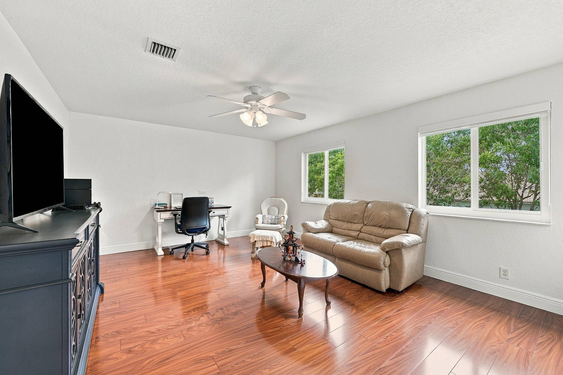 1020 Lavender Circle, Weston, FL 33327 Wood-finish flooring, white walls, and a ceiling fan