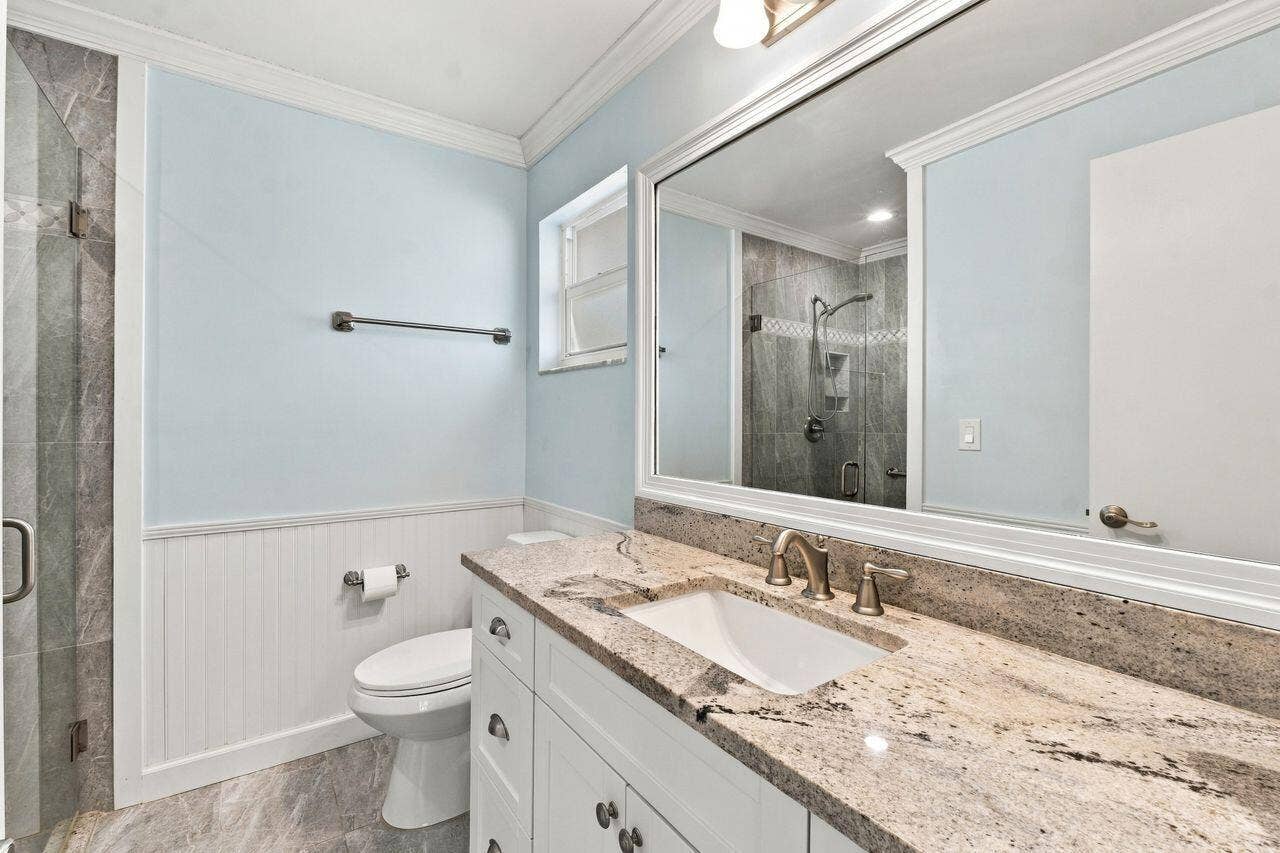 1003 SW 17th Street, Boynton Beach, FL 33426 Light blue walls with white wainscoting and totally updated