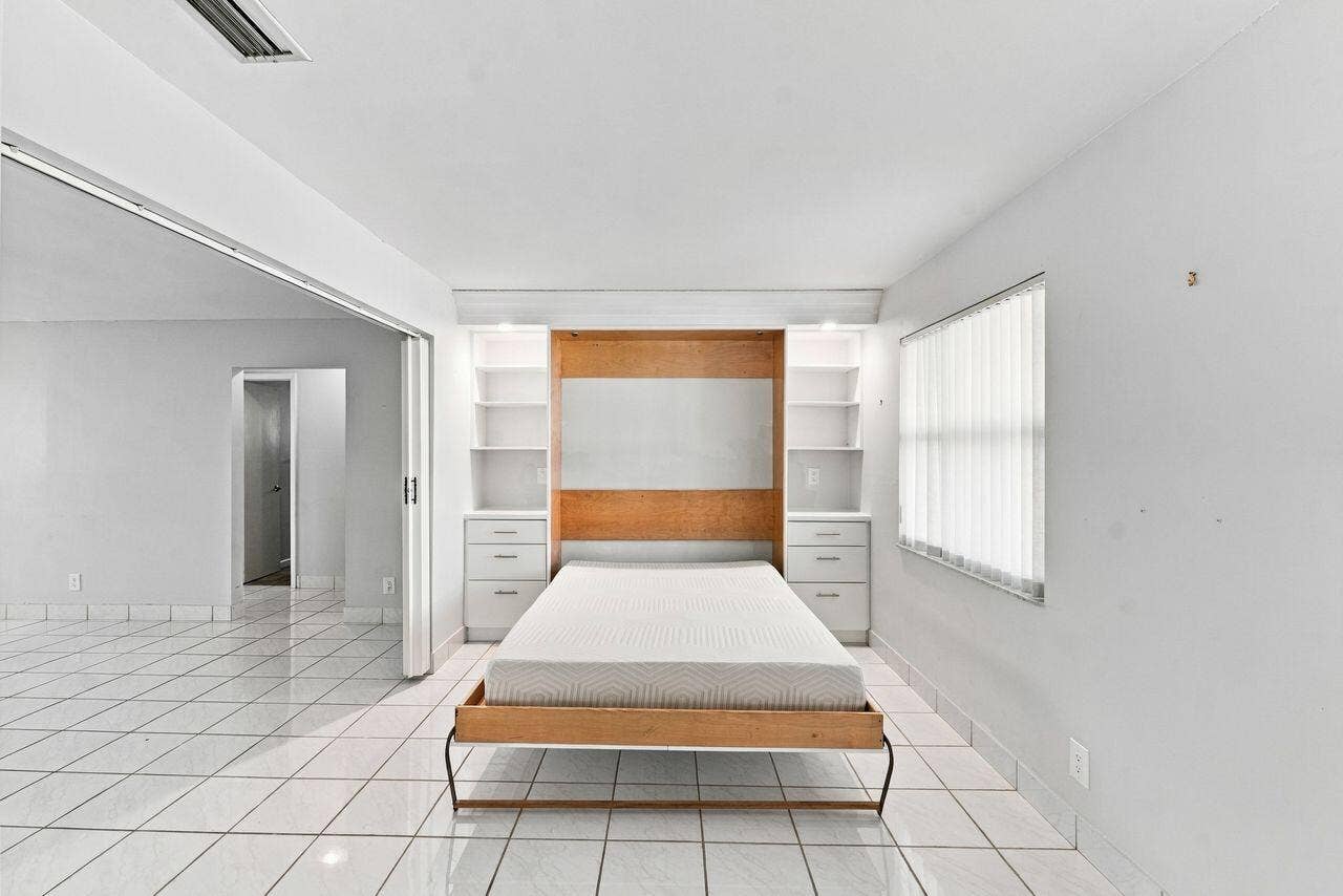 1003 SW 17th Street, Boynton Beach, FL 33426 Beautiful built in Murphy bed with custom bookshelves for extra sleeping space