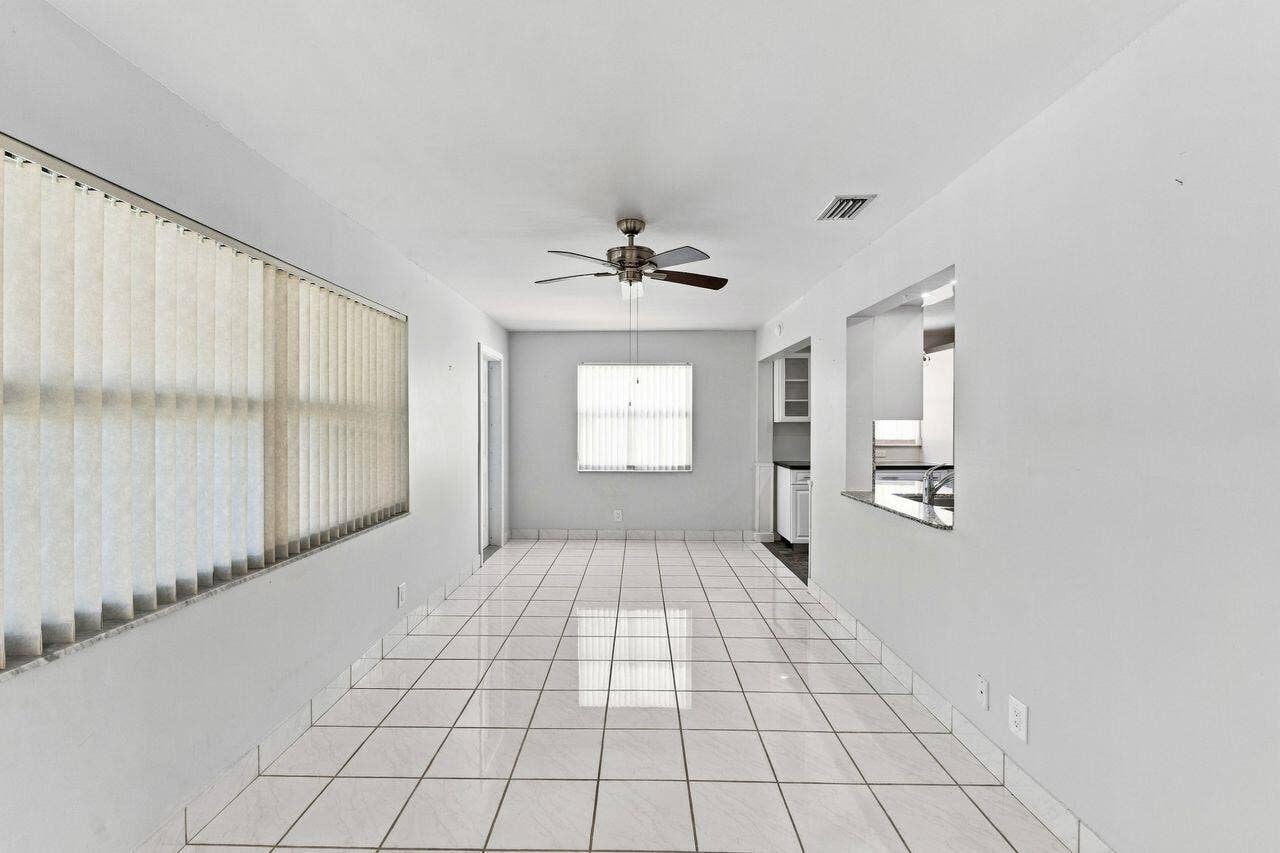 1003 SW 17th Street, Boynton Beach, FL 33426 Large, open area with pass through to kitchen and entrance to outside patio