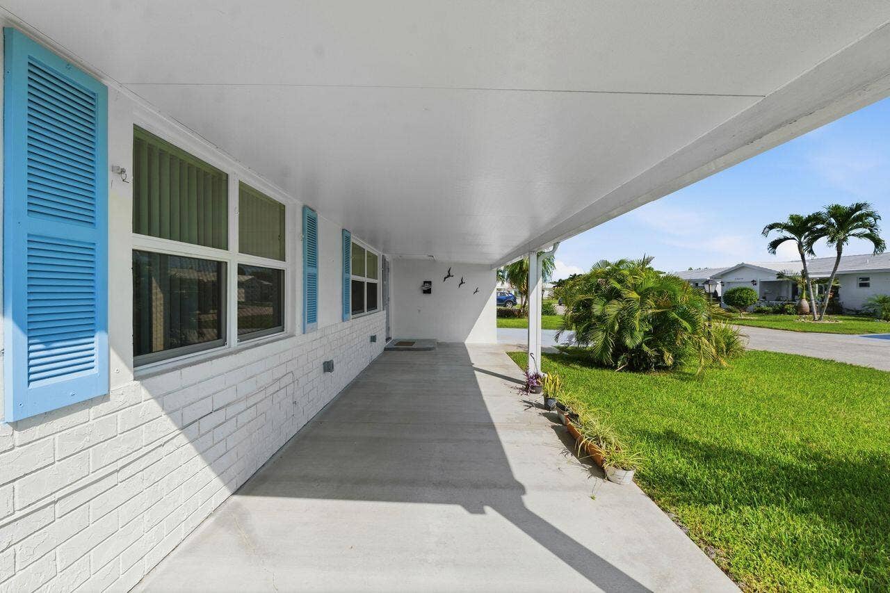1003 SW 17th Street, Boynton Beach, FL 33426 Newly added covered front porch with metal roof. perfect for morning coffee or just relaxing with friends