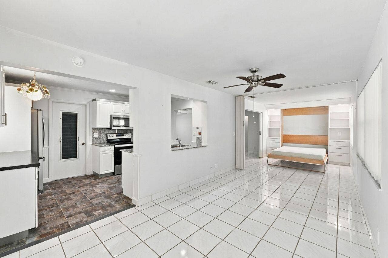 1003 SW 17th Street, Boynton Beach, FL 33426 Wonderful living space with built in Murphy bed at one end and plenty of dining area