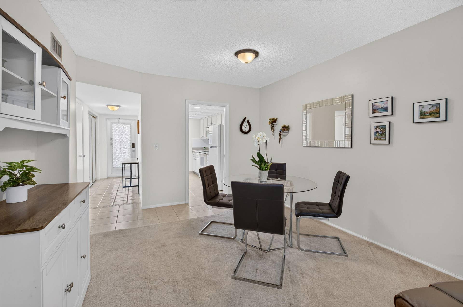 2320 SW 22nd Avenue, #211, Delray Beach, FL 33445 Open-concept dining and kitchen area featuring neutral wall finishes