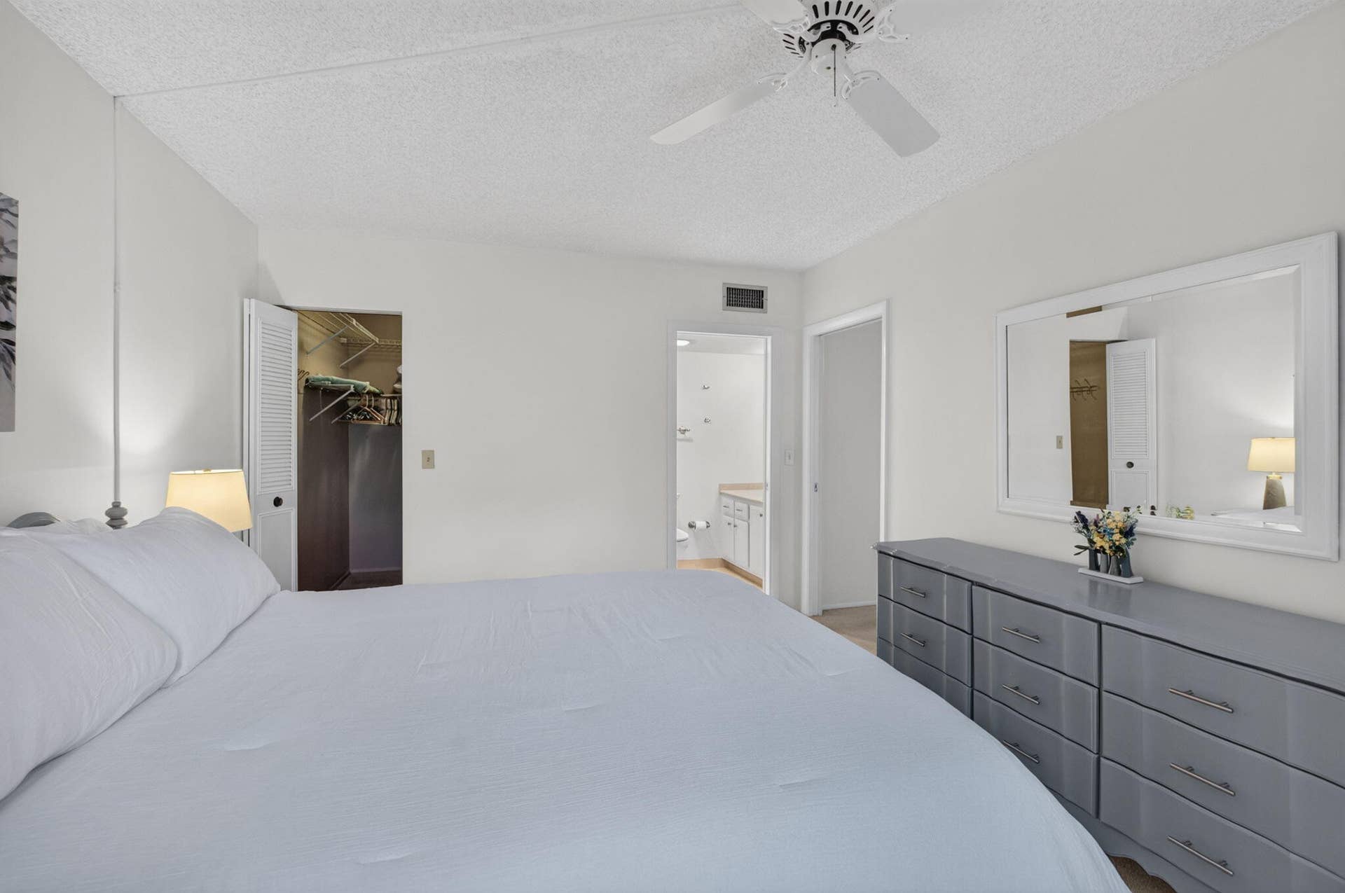 2320 SW 22nd Avenue, #211, Delray Beach, FL 33445 Primary bedroom featuring ensuite bath and walk-in closet.