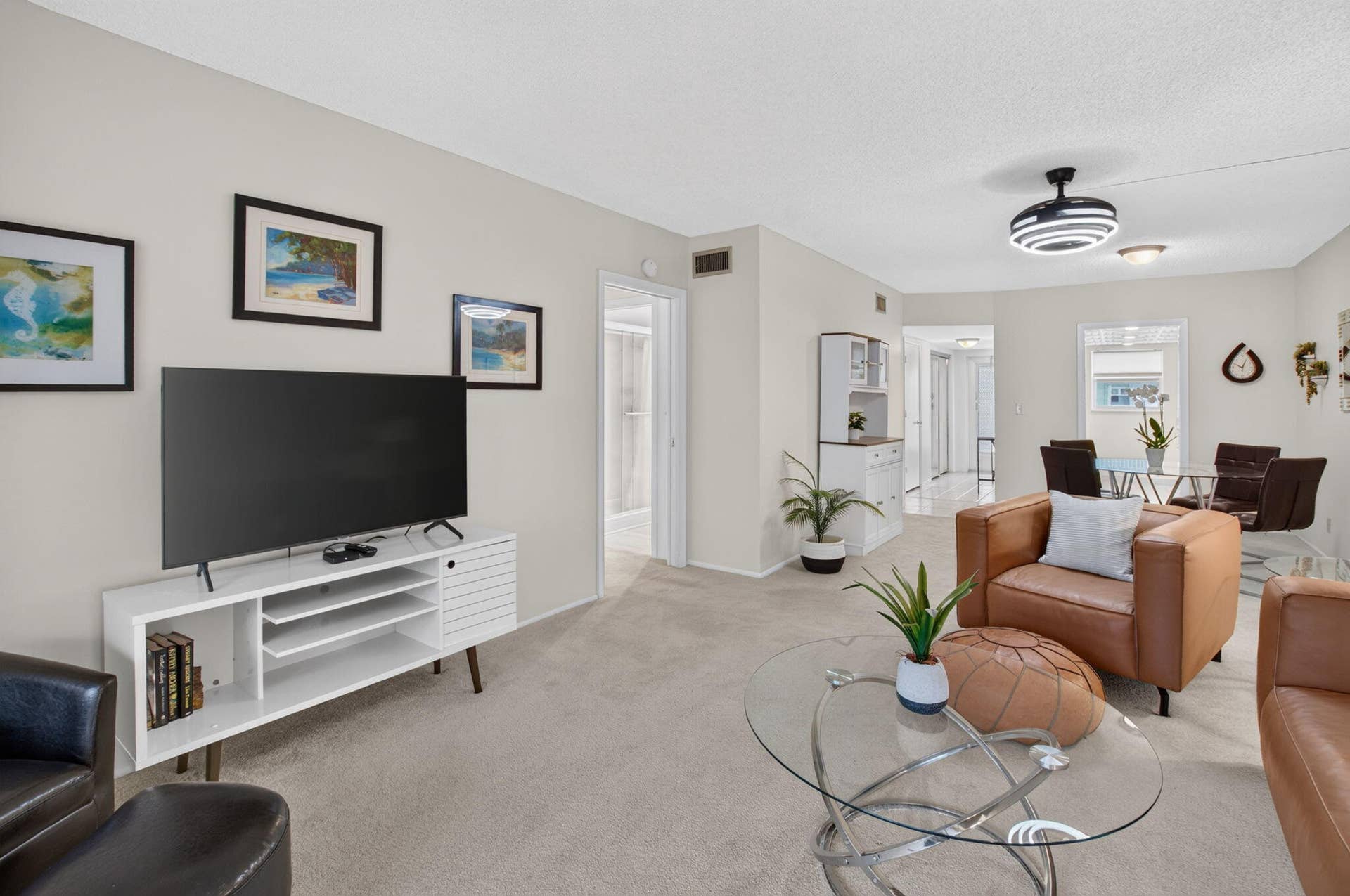 2320 SW 22nd Avenue, #211, Delray Beach, FL 33445 Carpeted flooring, and a modern ceiling fan with integrated lighting