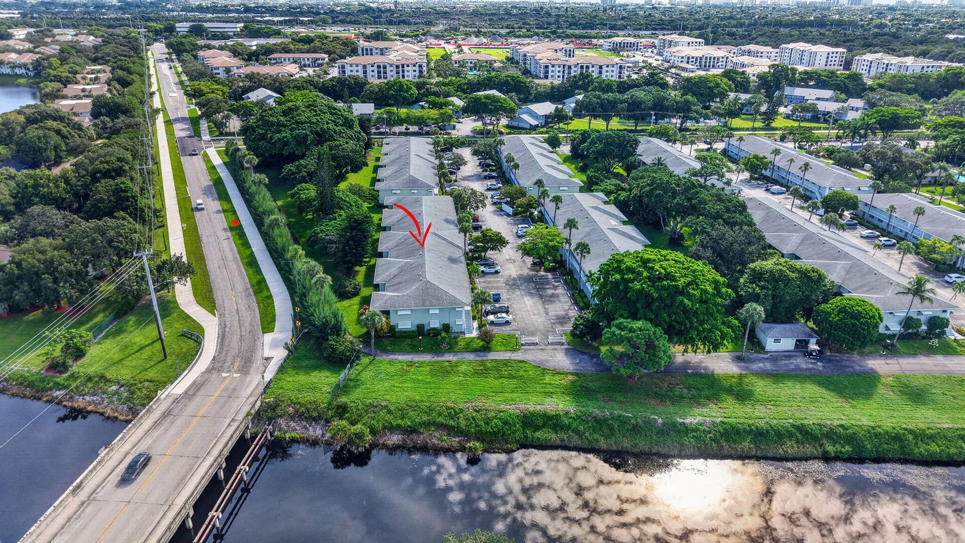 2320 SW 22nd Avenue, #211, Delray Beach, FL 33445 Canal views and lush landscaping
