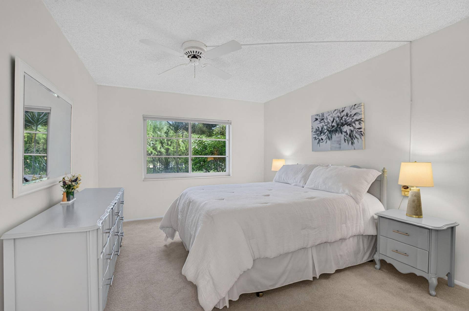 2320 SW 22nd Avenue, #211, Delray Beach, FL 33445 Primary bedroom featuring ensuite bath and walk-in closet.