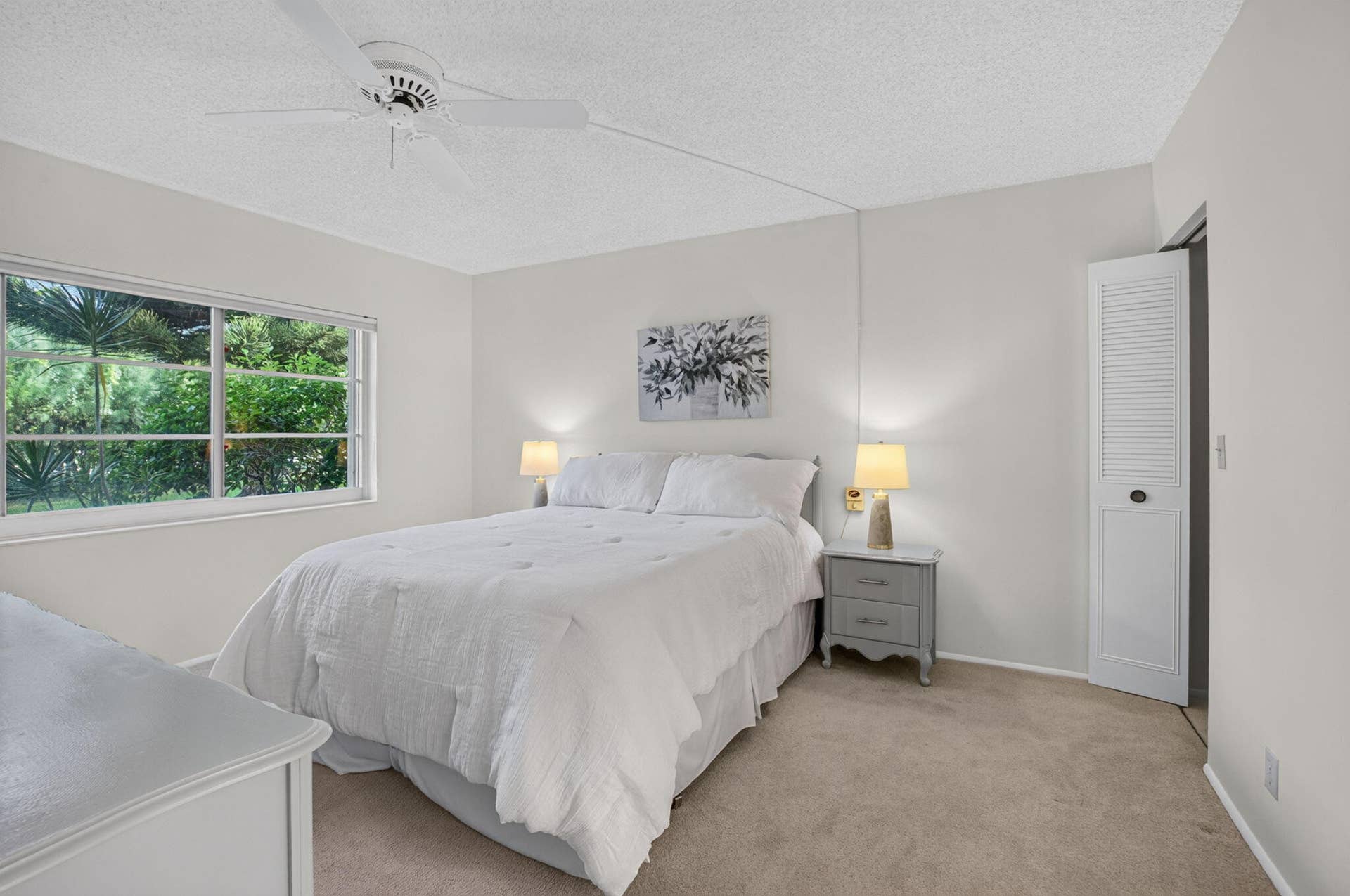 2320 SW 22nd Avenue, #211, Delray Beach, FL 33445 Primary bedroom featuring ensuite bath and walk-in closet.