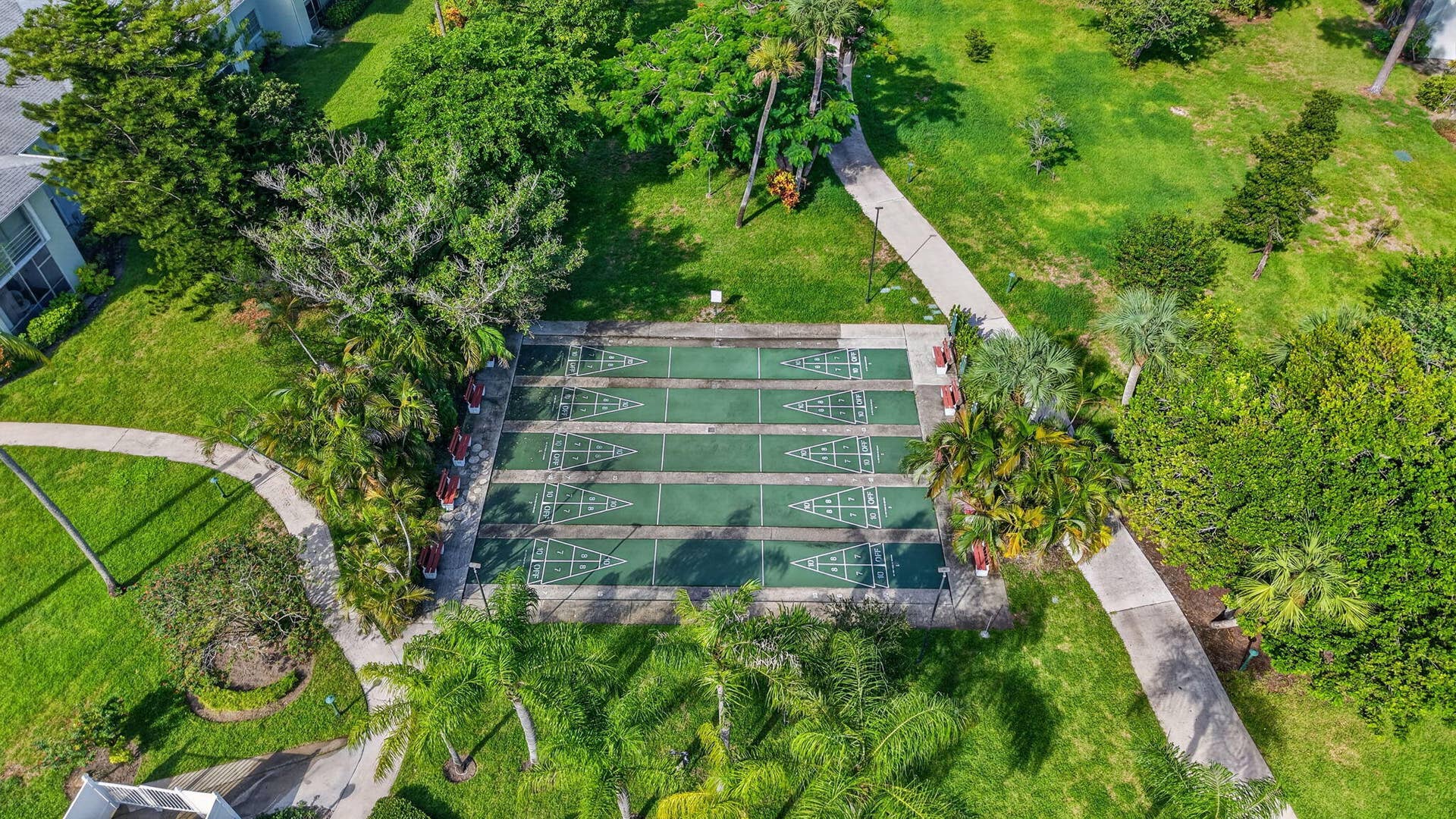 2320 SW 22nd Avenue, #211, Delray Beach, FL 33445 Shuffleboard courts surrounded by lush landscaping and walking paths