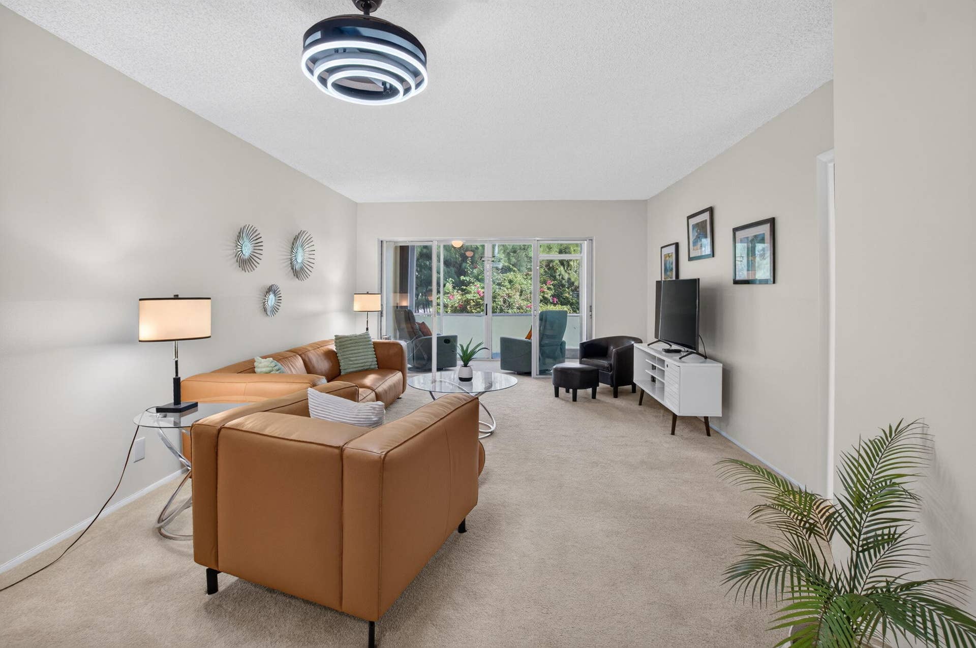 2320 SW 22nd Avenue, #211, Delray Beach, FL 33445 Light-colored carpeting, neutral wall paint, and a modern ceiling light fixture
