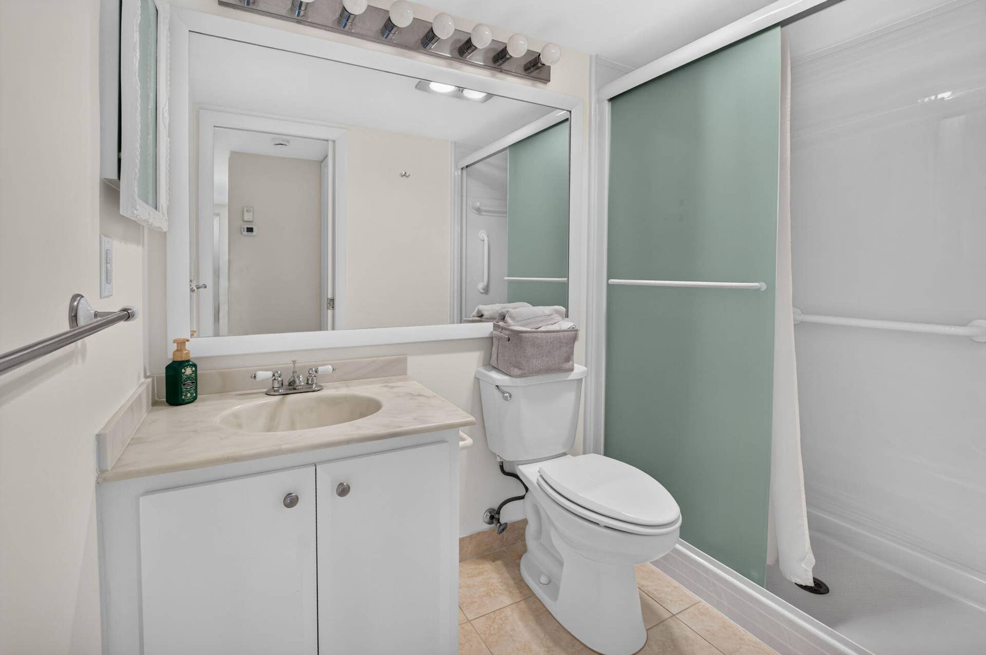2320 SW 22nd Avenue, #211, Delray Beach, FL 33445 Guest bath with shower with sliding glass enclosure