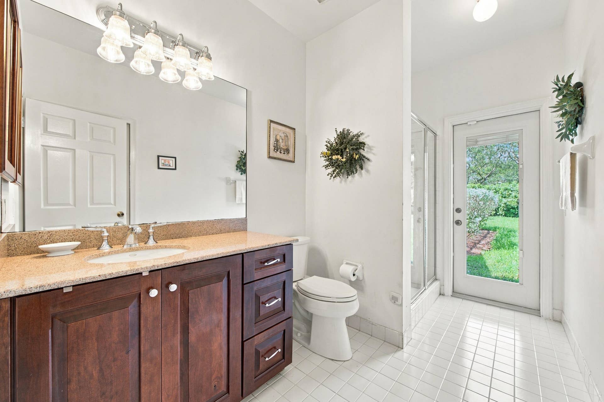 1985 Landing Way, Weston, FL 33326 Vanity with wood-finish cabinetry, light-toned countertop, and integrated sink