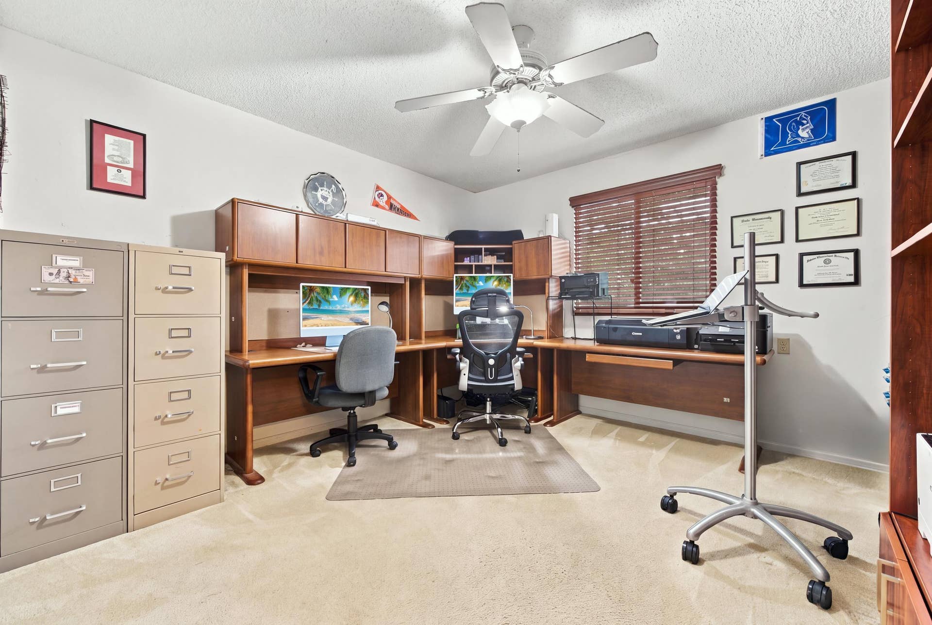 1985 Landing Way, Weston, FL 33326 Built-in wooden desk with integrated cabinetry, window with wooden blinds, and ceiling fan with integrated lighting