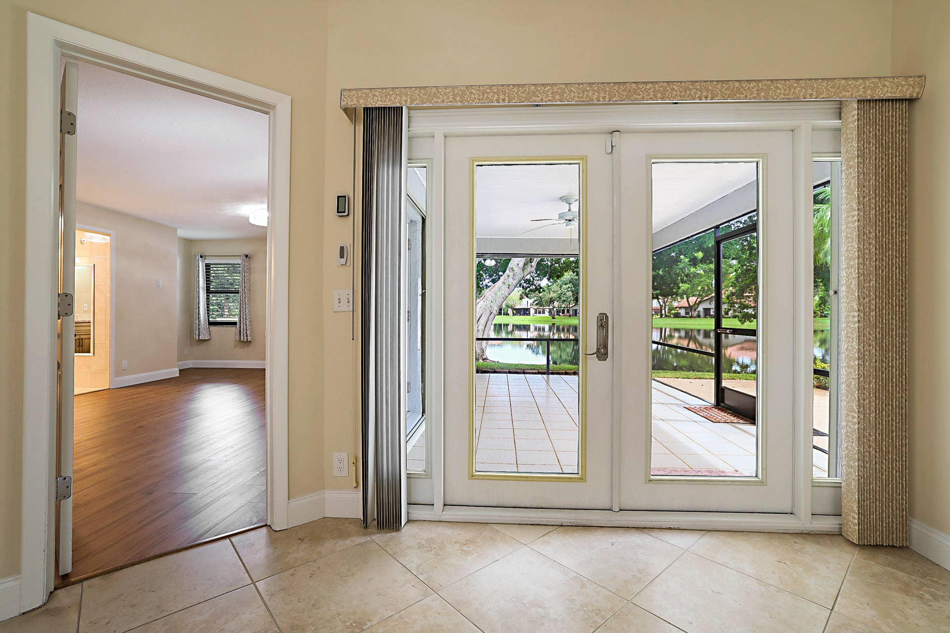 702 DEER CREEK NORTH SHORE Drive, Deerfield Beach, FL 33442 French Doors out to Screened Porch
