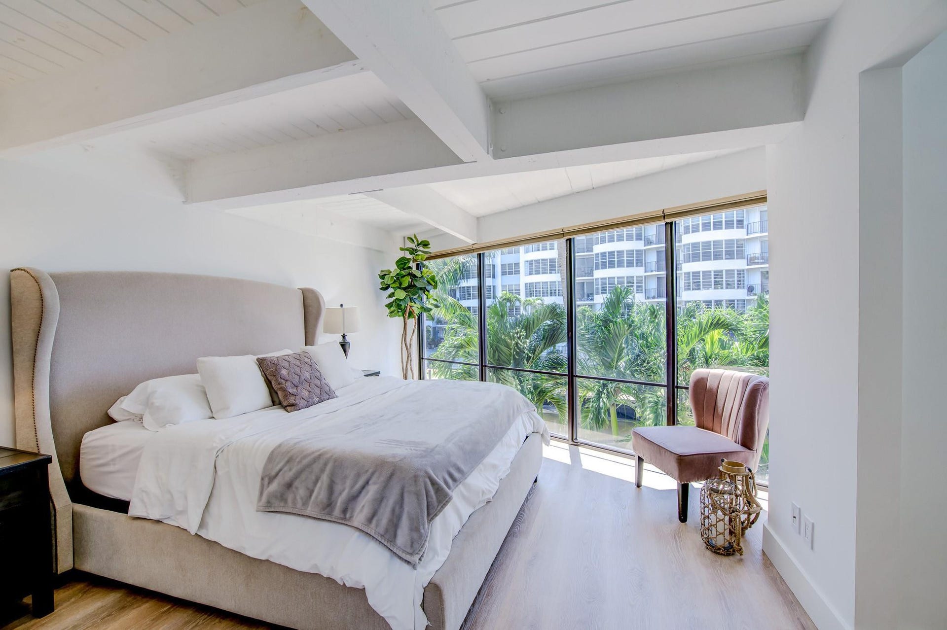 Exposed beam ceiling with wood-finish flooring