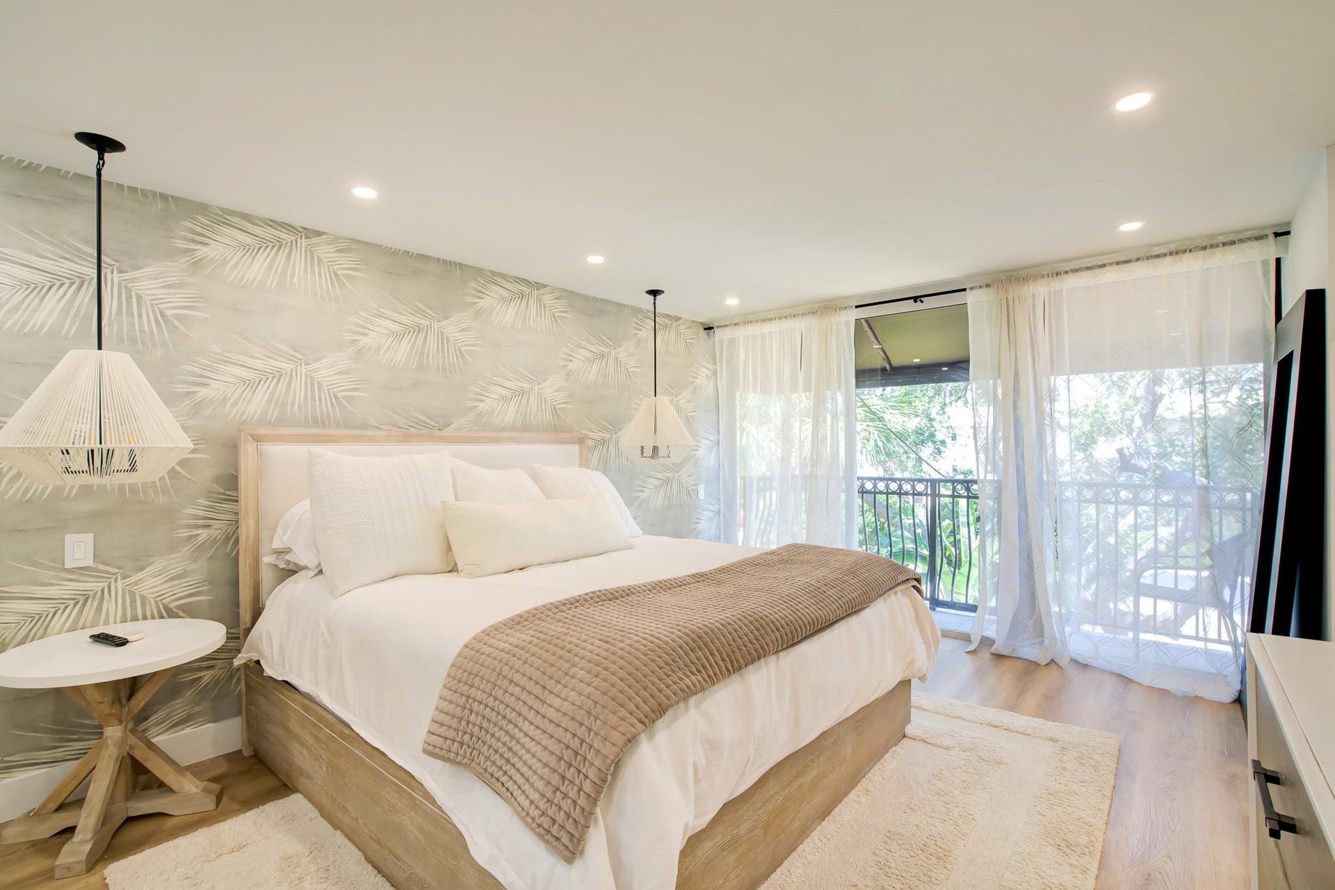 Light wood-finish flooring with recessed ceiling lighting