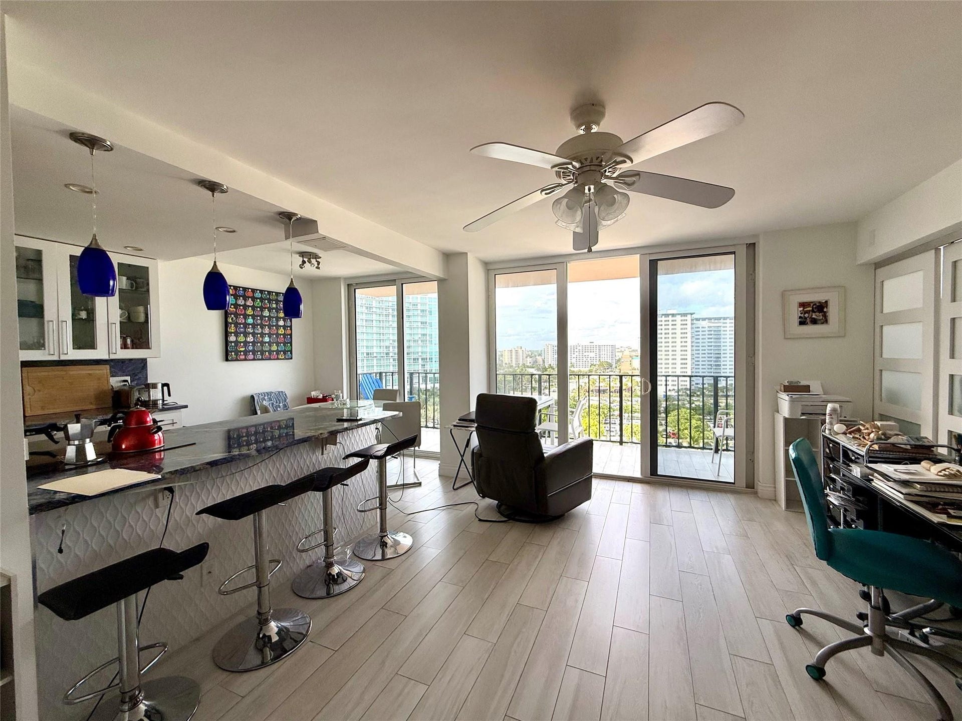 101 Briny Avenue, #1107, Pompano Beach, FL 33062 Kitchen/living room with extended balcony