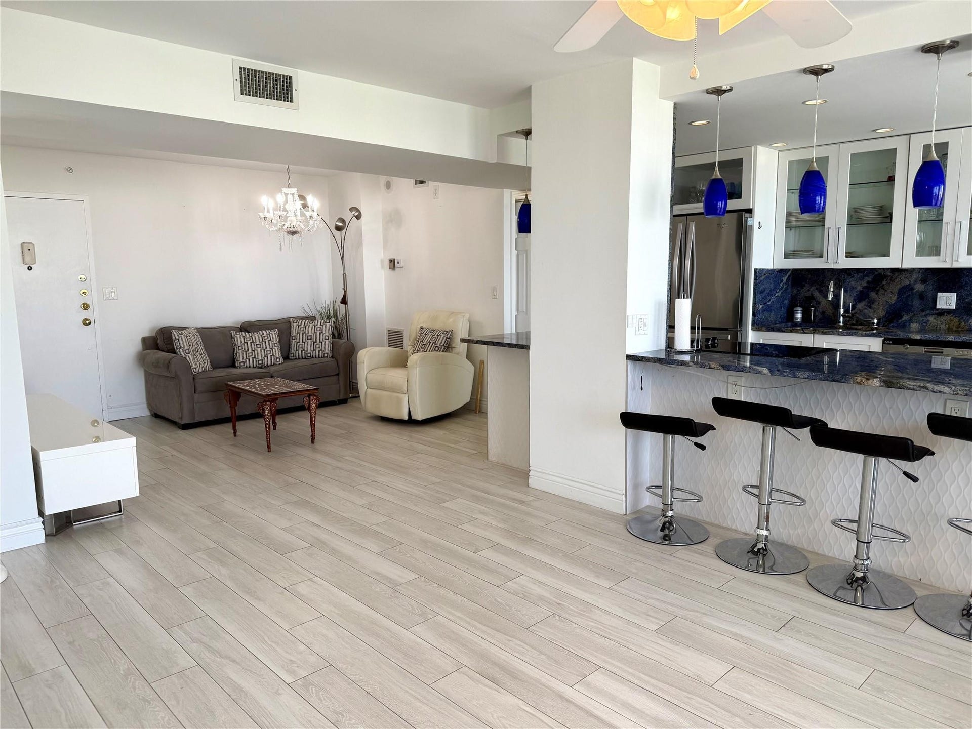 101 Briny Avenue, #1107, Pompano Beach, FL 33062 Open kitchen and sitting area