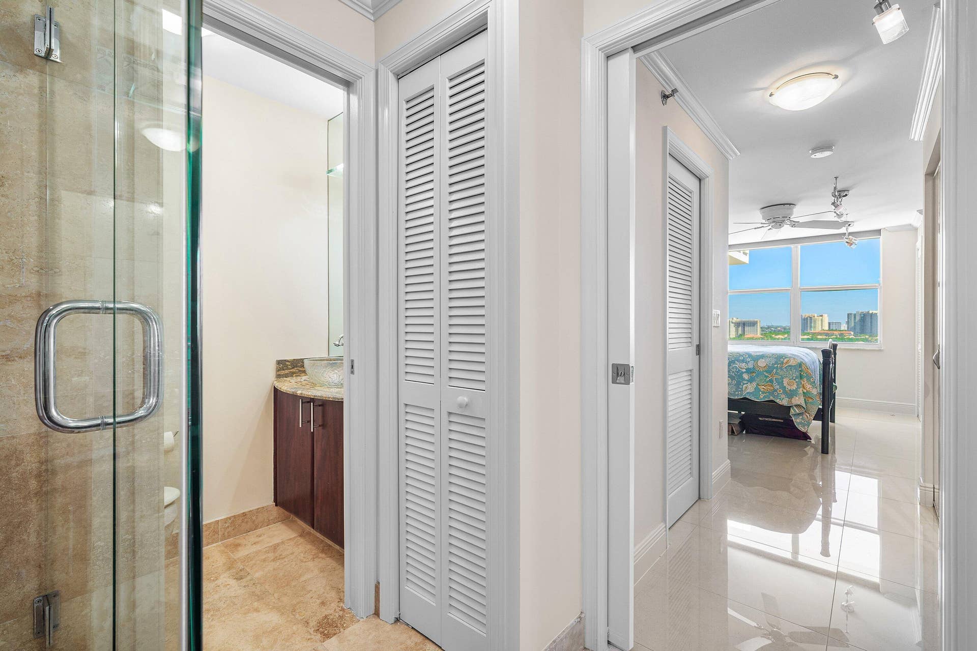 4505 S Ocean Boulevard, #1008, Highland Beach, FL 33487 Separate toilet room with sink in the main bathroom with linen closet