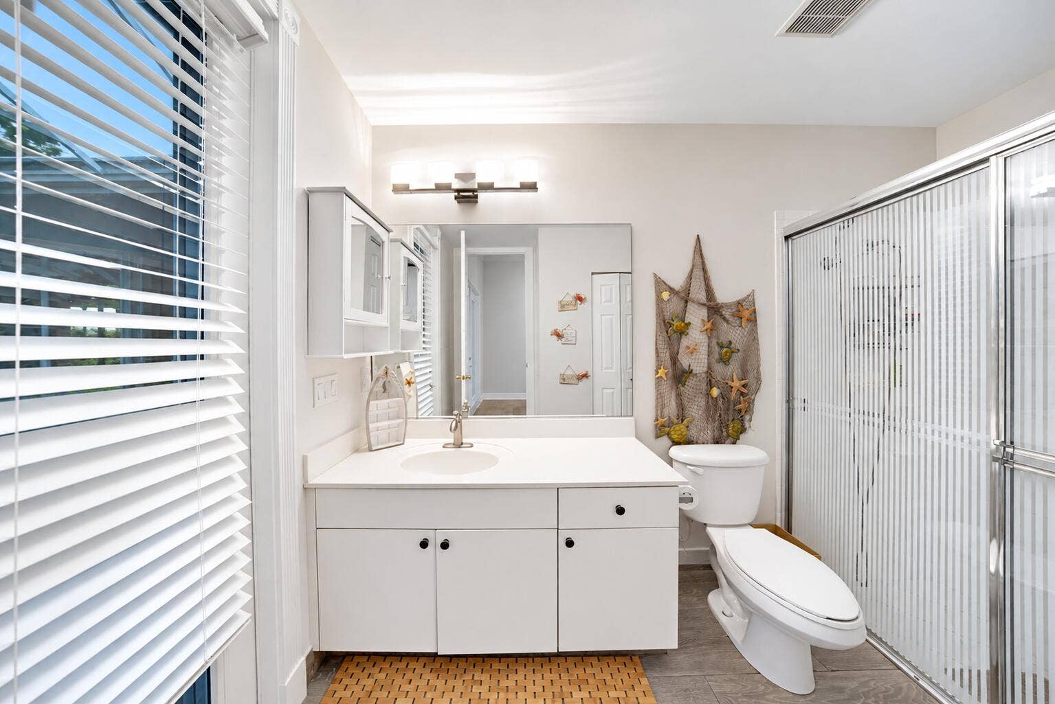 11950 NW 3RD Drive, Coral Springs, FL 33071 Bright Coastal Bathroom with Nautical Ac